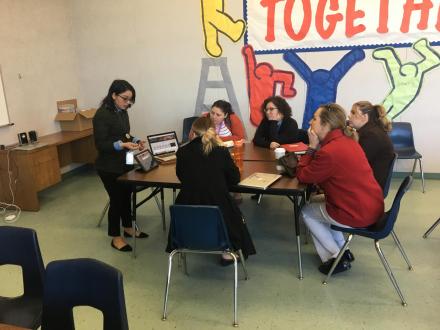 A group of teachers holding a meeting.