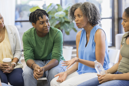 Students and teachers hold a meeting