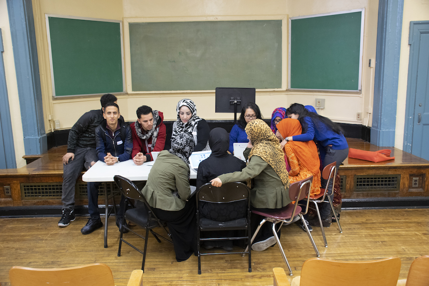 Teacher talking with a group of students